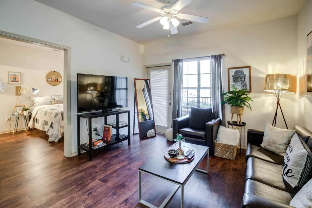 The-Mill-at-Auburn-Off-Campus-Apartments-Near-Auburn-University-Fully-Furnished-Apartments-Hardwood-Flooring-55-Inch-Smart-TV-in-Living-Room-Renovated-Floor-Plans-1